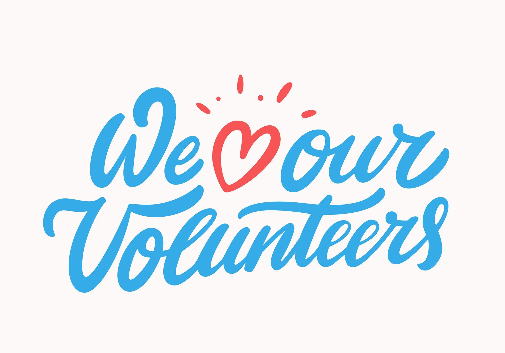 Image: We heart our volunteers. Blue writing with a read heart. 
