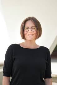 Image of Jennifer Douglas, UBC professor and Keynote speaker. Short light brown hair, glasses, and black 3/4 inch sleeves - white background. 
